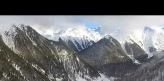 Free Background Upload videos flying over the snowy mountains